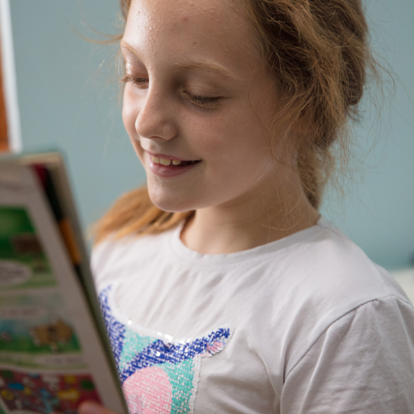 a girl reading magazine