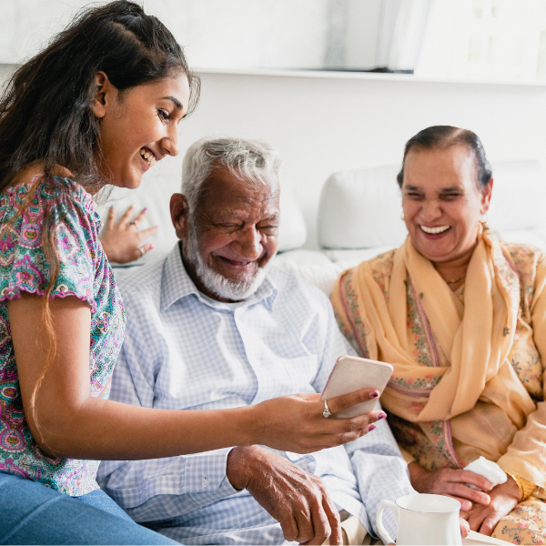 Grandparents engaging in a social studies activity with children, promoting intergenerational learning and family bonding.