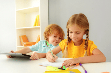 Kids studying from workbook